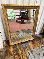 Front view of gilded frame beveled mirror