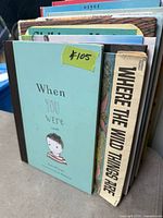 Stack of children’s books showing When You Were Small cover and additional spines
