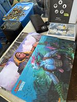 Overview of both playmats, binder, storage tube, art print