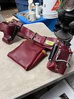 Full view of leather tool belt with attached pouches and holders