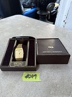 Watch in open display box showing overall set