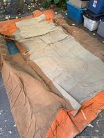 Canvas tent shell laid flat showing overall size and color