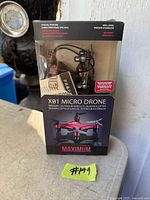Front view of sealed Maximum X01 Micro Drone retail box