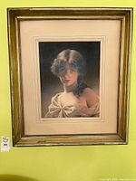 Full view of framed art print on wall