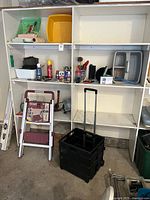 Overall lot showing shelving with step stool, rolling crate, assorted tools and supplies