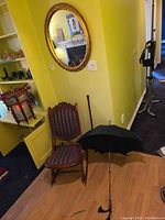 Mirror, chair and umbrella in situ