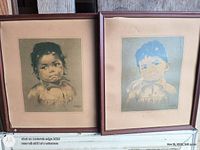 Both framed prints side by side showing subjects and frame style