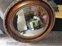 Front view of round mirror showing full frame and glass