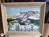 Frontal view of framed mountain landscape painting