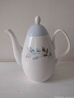 Side view of Foley bone china teapot with lid showing pattern and form