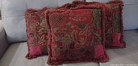 Three square tapestry cushions on sofa showing overall style, colour and condition