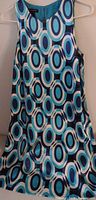 Front view of sleeveless geometric print dress