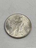 Reverse of 1922 Peace dollar showing eagle, legends and surface condition