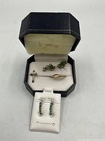 All jewellery items in open presentation box and earring card