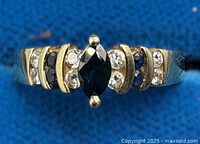 Front view of Birks 14K gold ring showing marquise sapphire flanked by diamonds and sapphires