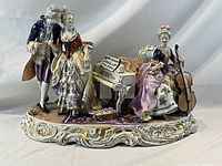 Front view of entire porcelain musicians group
