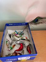 Box containing all eleven glass bird ornaments