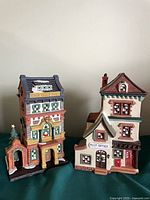 Front view of both ceramic buildings