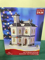 Front of boxed Holiday Time Victorian House