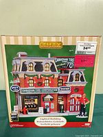 Front of box showing Lemax Canadian Tire lighted building