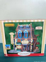 Front of box showing Barsom's Furniture Shop model