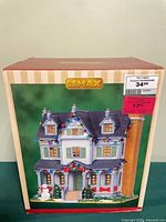 Front of box showing Lemax Davis Residence house image and retail sticker