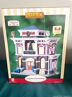 Front of box showing Lemax Police Precinct 11 building image and branding