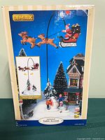 Front of boxed Lemax animated table accent