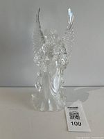 Full view of clear acrylic angel figurine
