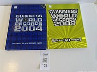 Front covers of 2004 and 2009 Guinness World Records hardcovers side by side