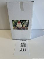 Factory sealed box front with product sticker showing nesting doll set