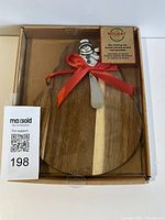 Full view of boxed serving set showing board and spreader