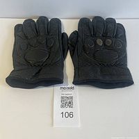 Top view of both gloves showing knuckle padding and perforations