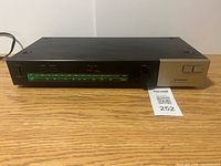 Front view of Pioneer TX-130 tuner showing full unit and green frequency display