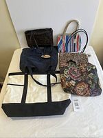 Group view of six assorted bags placed on table