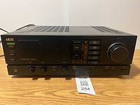 Front view of Akai AM-52 amplifier showing controls and volume knob