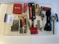 All items laid out on clear lid for overview