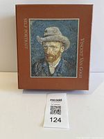 Closed brown presentation box with Van Gogh self portrait cover