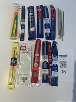 Overview of packaged hooks, stitch holder, gauge, loose hooks