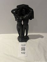 Front view of Avery Creations kissing couple sculpture