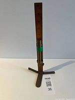 Full view of wooden ruler on metal base