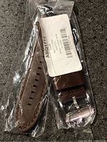 Front view of sealed Fossil leather watch band showing strap and buckle