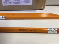 Close view of Amazon Basics No.2 HB pencil showing branding, ferrule, and eraser