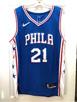 Front view of blue PHILA 21 jersey on hanger