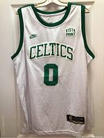 Front view showing Nike swoosh, Celtics wordmark, number 0, Vista Print patch, jock tag