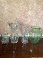 Front view of four vases lined up