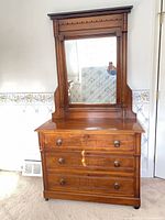 Front view showing dresser with mirror attached