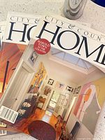 Three magazines fanned to show typical cover design and condition