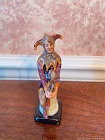 Front view of Royal Doulton “The Jester” figurine showing overall form and colour