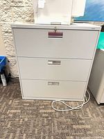 Front view showing three drawers and overall condition